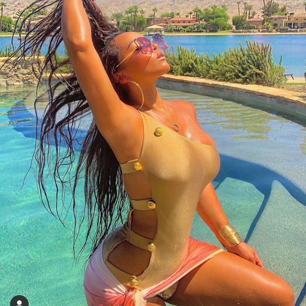 Gold monokini WJW swim suit. Fits a size Medium.